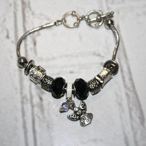 Beautiful silver and black toggle bracelet with angel charms 8-8.5"